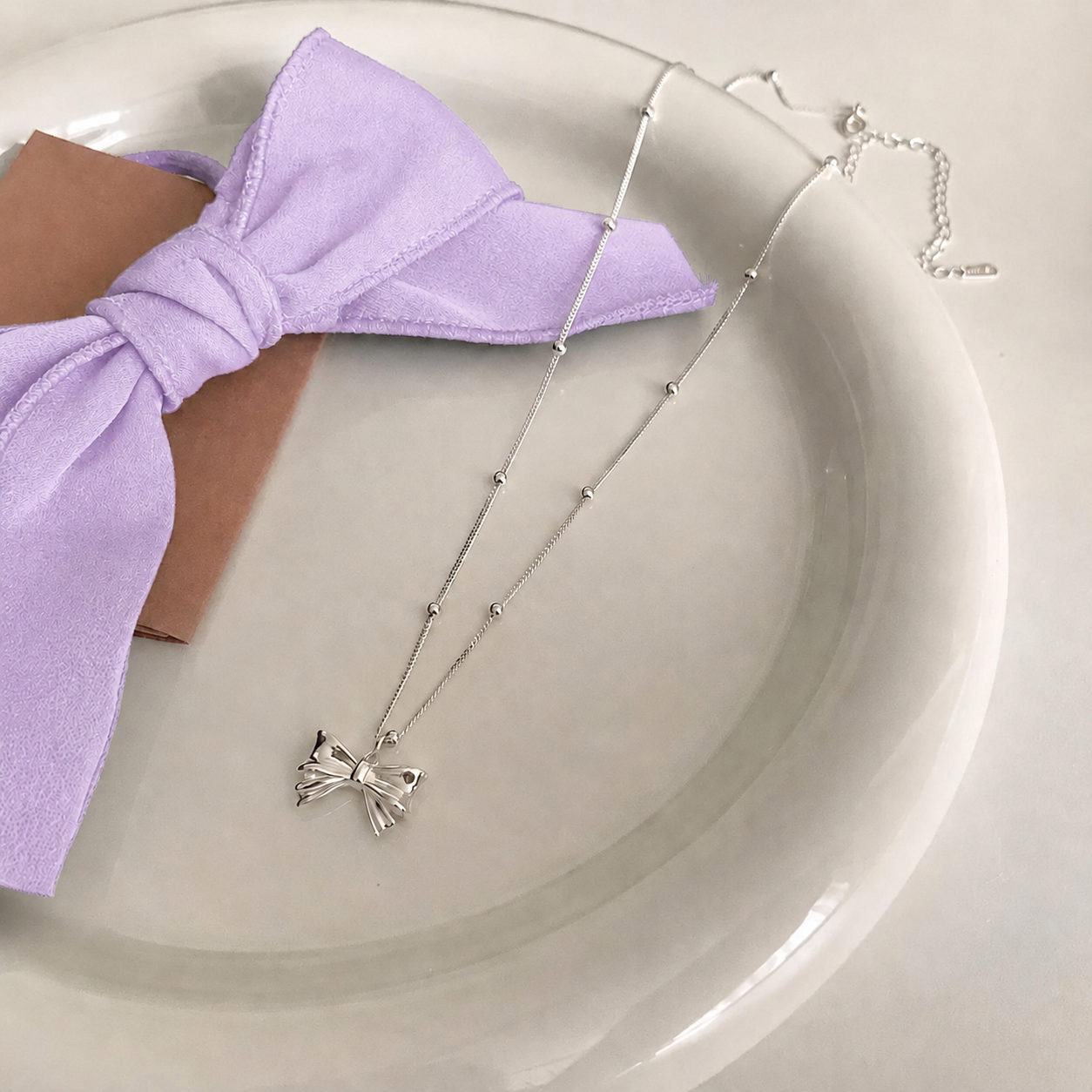 Silver Bow Pendant Necklace