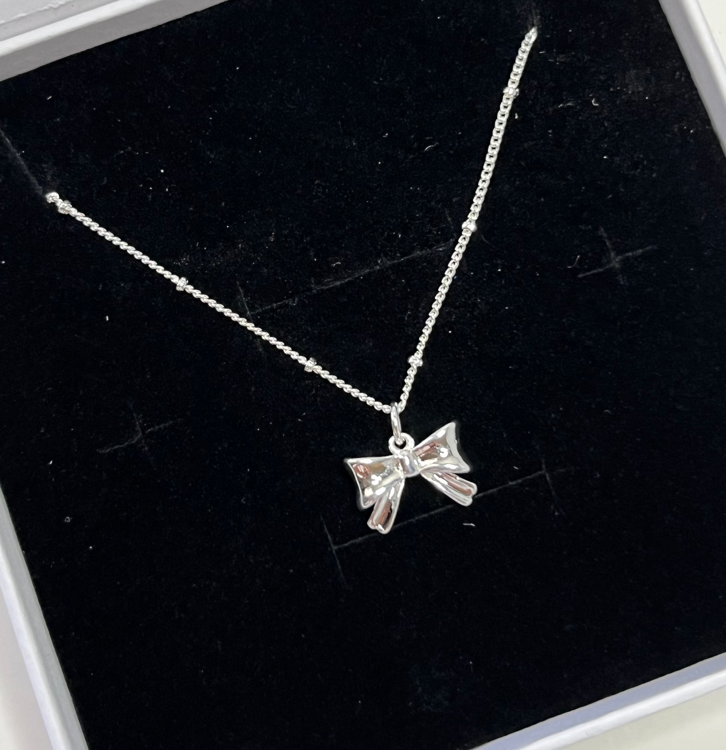 Silver Bow Pendant Necklace