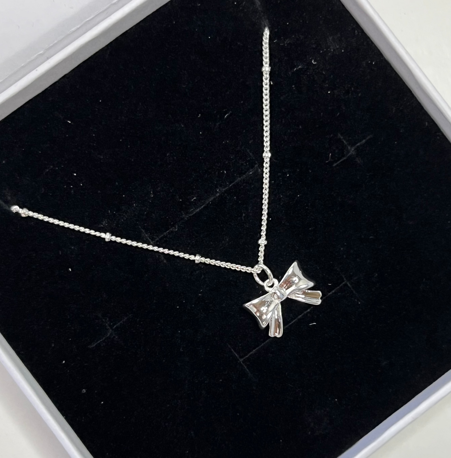 Silver Bow Pendant Necklace
